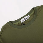 Olive green crewneck sweatshirt neckline with brand tag at collar