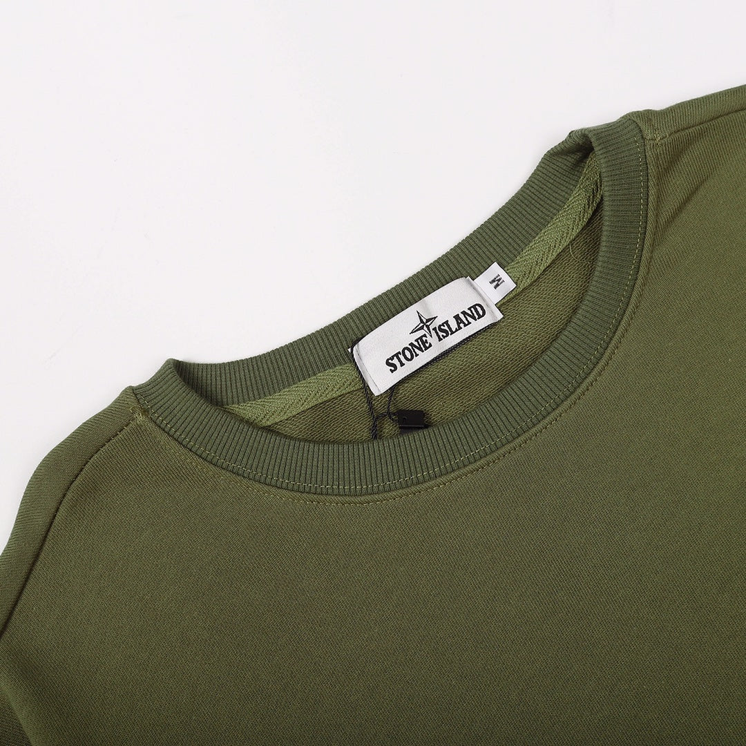 Olive green crewneck sweatshirt neckline with brand tag at collar
