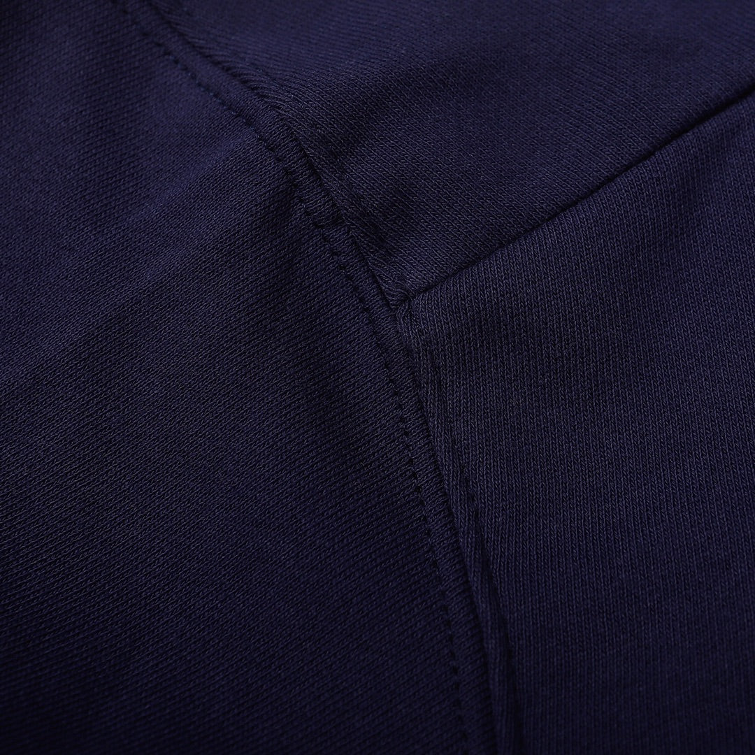 Navy sweatshirt close-up of front seam with subtle stitch detail