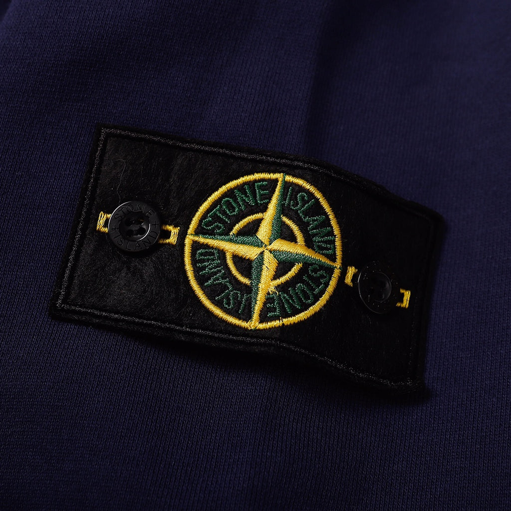 Navy sweatshirt with Stone Island logo patch on the sleeve