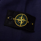 Navy sweatshirt with Stone Island logo patch on the sleeve