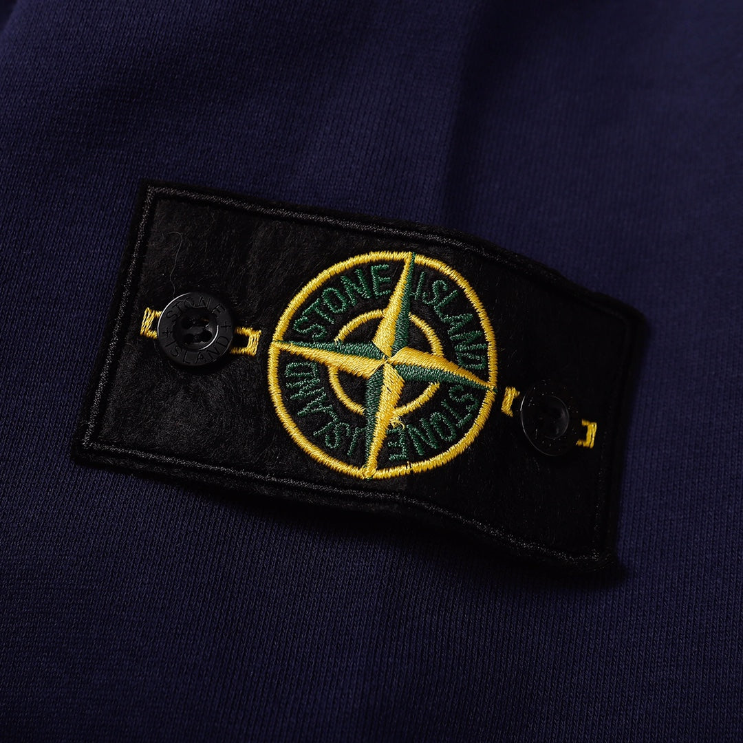 Navy sweatshirt with Stone Island logo patch on the sleeve