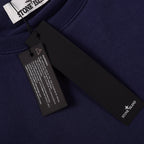Navy sweatshirt with interior label tags and stitched neck binding