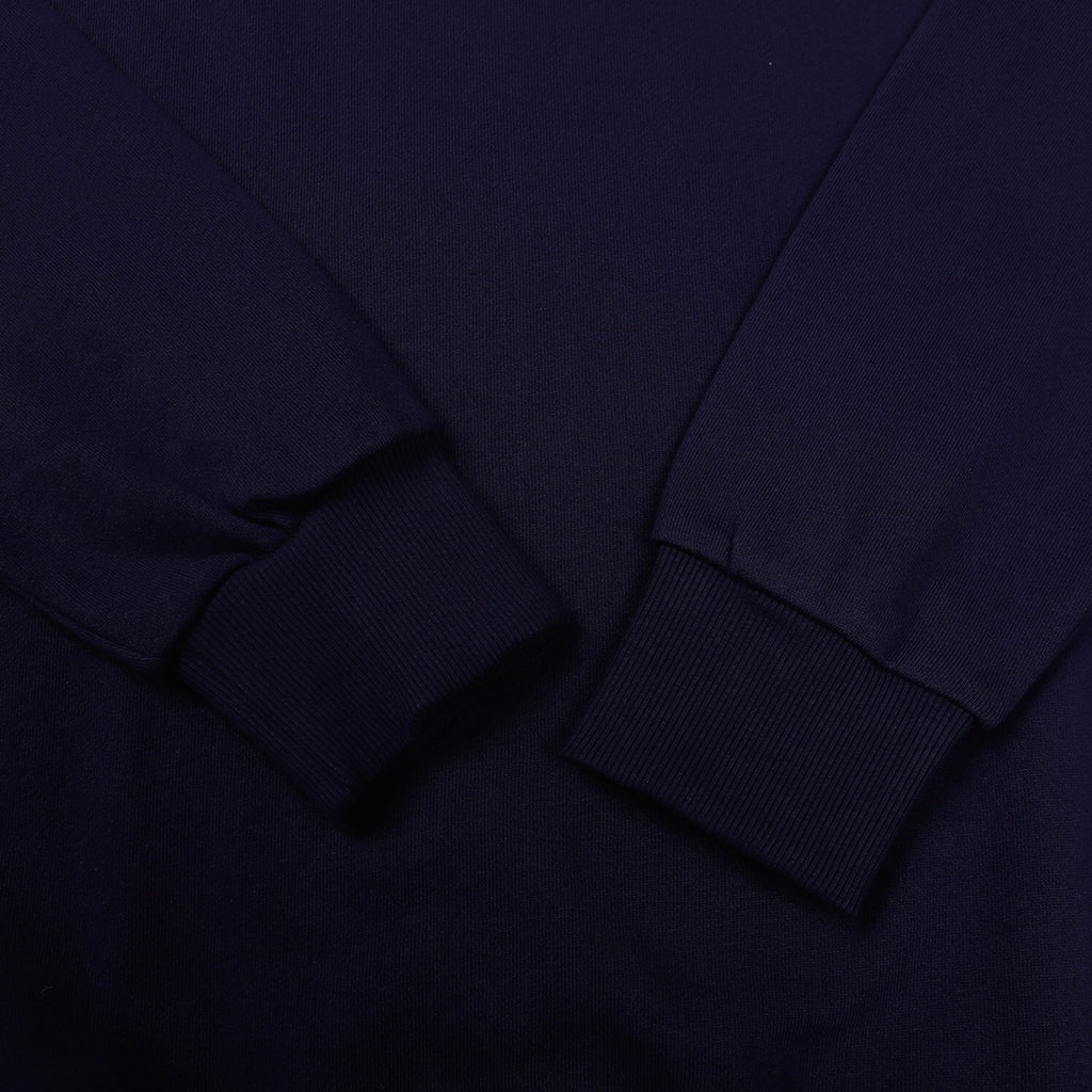 Navy crewneck sweatshirt sleeve cuff and neckline seam detail