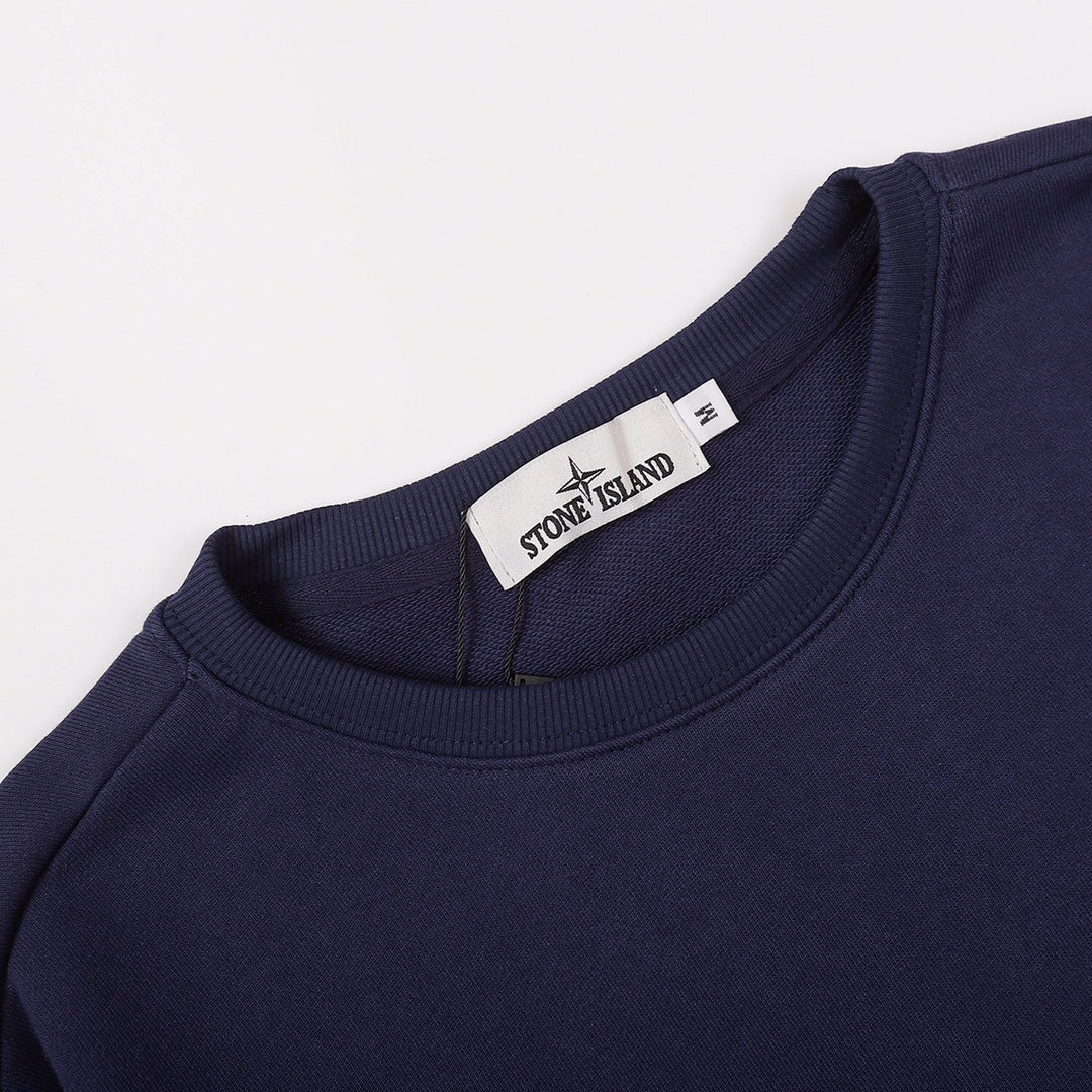 Navy crewneck sweatshirt collar with Stone Island label at the neck