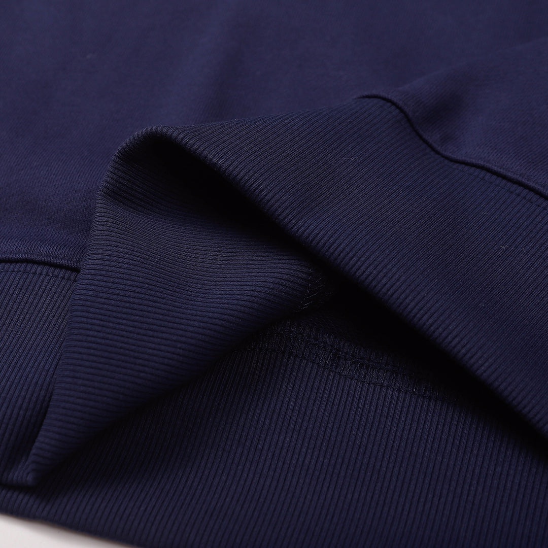 Navy sweatshirt fabric texture with rolled fold near the hem
