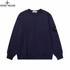 Navy crewneck sweatshirt with long sleeves and ribbed cuffs and hem