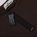 Stone Island crewneck sweatshirt neckline with brand label and hanging size tag