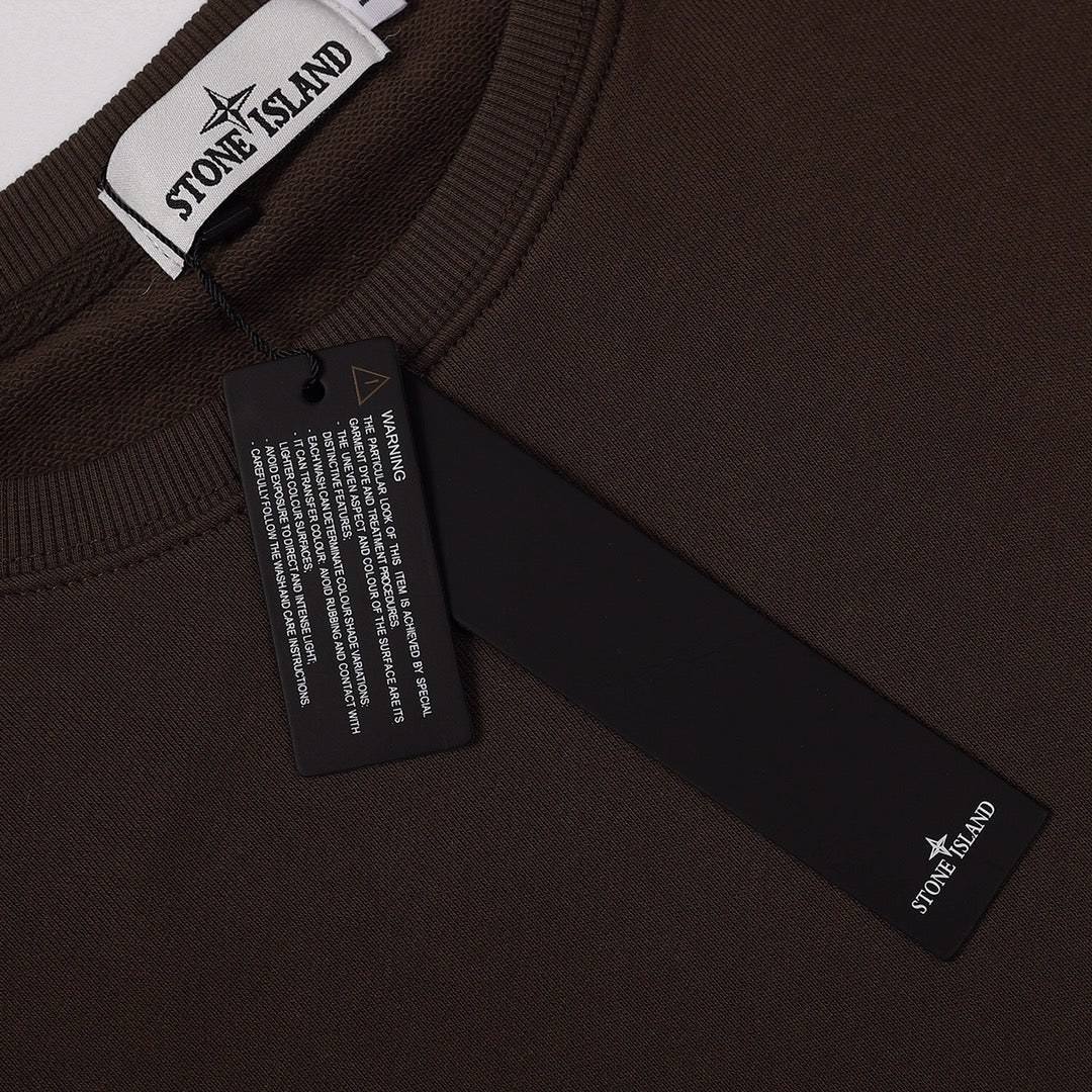 Stone Island crewneck sweatshirt neckline with brand label and hanging size tag