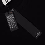Stone Island black crewneck sweatshirt fabric tag and sleeve logo