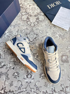 Dior unisex low-top lace-up sneakers, cream and navy, CD logo on sides.