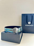 Versace belt with blue and teal patterned strap and silver Medusa-head buckle