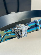 Versace belt strap close-up in blue and teal pattern with ornate silver Medusa buckle