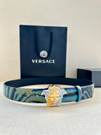 Versace belt with blue and teal striped strap and gold Medusa buckle with silver accents