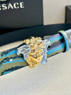 Versace belt close-up: blue and teal striped strap with gold Medusa buckle and silver hardware