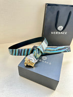 Blue, teal and purple print belt with Medusa gold-and-silver buckle