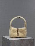 YSL shearling bag with top handle, cream teddy-fabric body and brown leather strap detail