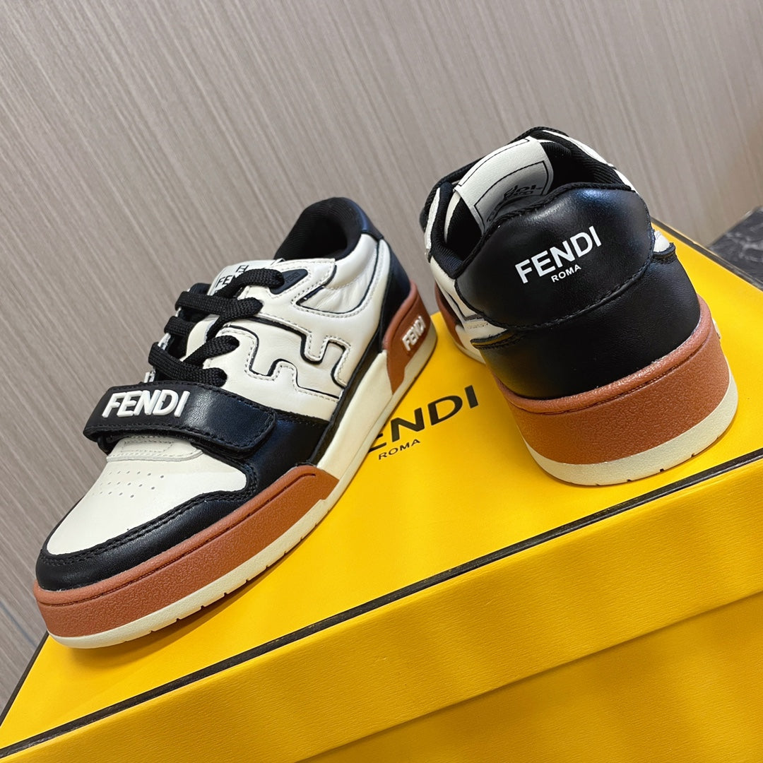 Fendi unisex sneakers, front view with white uppers, black toe and tan outsole