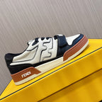 Fendi unisex sneakers on display with white leather, black side panel, tan sole trim