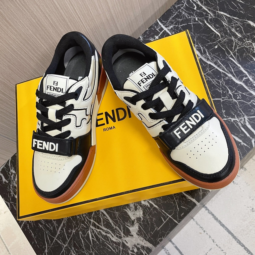 Fendi unisex sneakers with black laces, white uppers and Fendi branding on strap