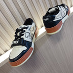 Fendi unisex sneakers from side view with black and white panels and tan sole