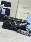 Black Prada leather shoulder bag with gold-tone hardware and top handle strap