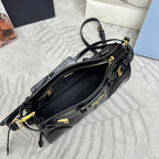 Black leather mini bag with front zipper, gold-tone hardware, and crossbody strap