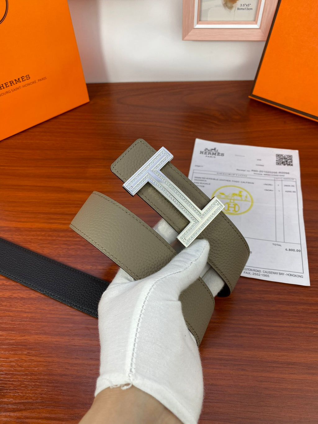 Hermes reversible belt with dark strap and light olive strap, silver H buckle centered