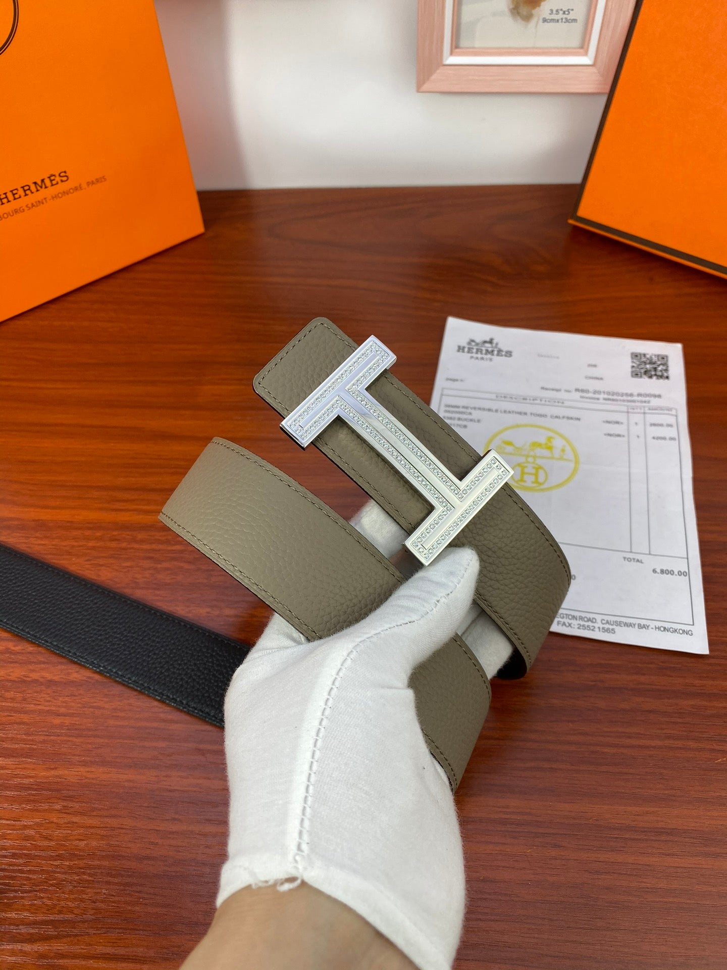 Hermes reversible belt with dark strap and light olive strap, silver H buckle centered
