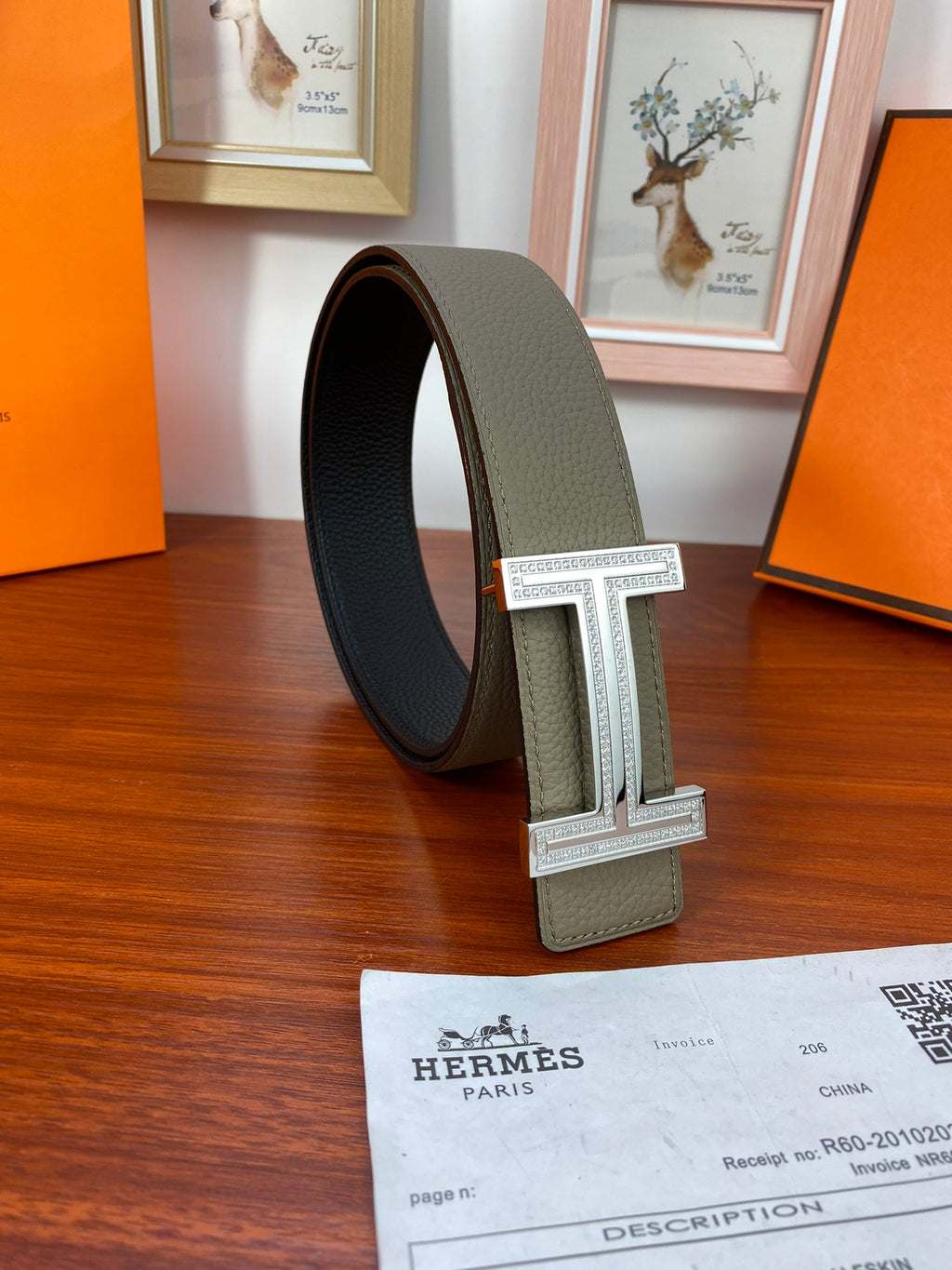 Hermes reversible belt standing upright: light olive leather with silver square buckle
