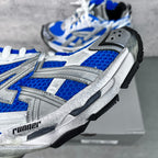 Unisex sneakers close-up of blue mesh panels, silver overlays, lace-up