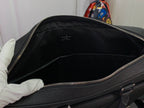 Open men's Louis Vuitton briefcase interior with zip opening and side wall
