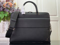 Louis Vuitton handbag with top handle, flap front, and adjustable shoulder strap, dark