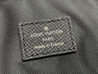 Louis Vuitton Paris made in France label on textured bag panel