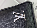 Textured black leather flap with metallic Louis Vuitton logo emblem