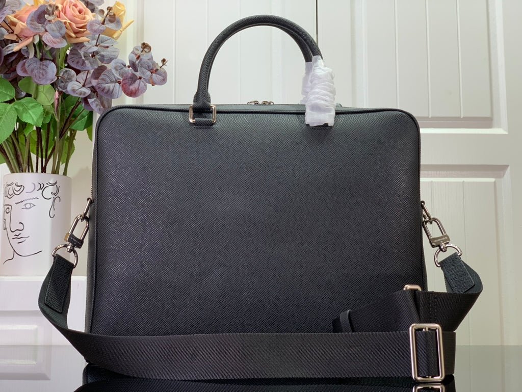 Men's Louis Vuitton briefcase with top handle and front strap buckle