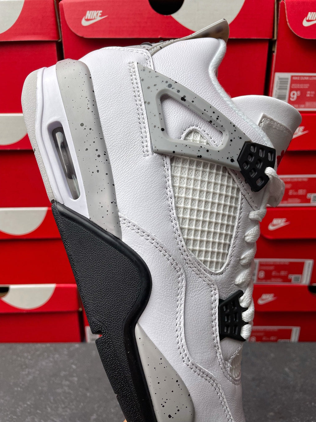 White high-top sneaker with quilted mesh panel and black midsole trim