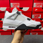 White and black high-top sneaker with mesh side panel and black heel tab