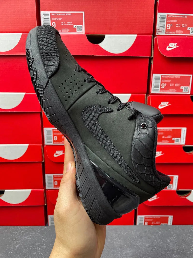 Black lace-up mid-top athletic sneaker with textured paneling and side swoosh