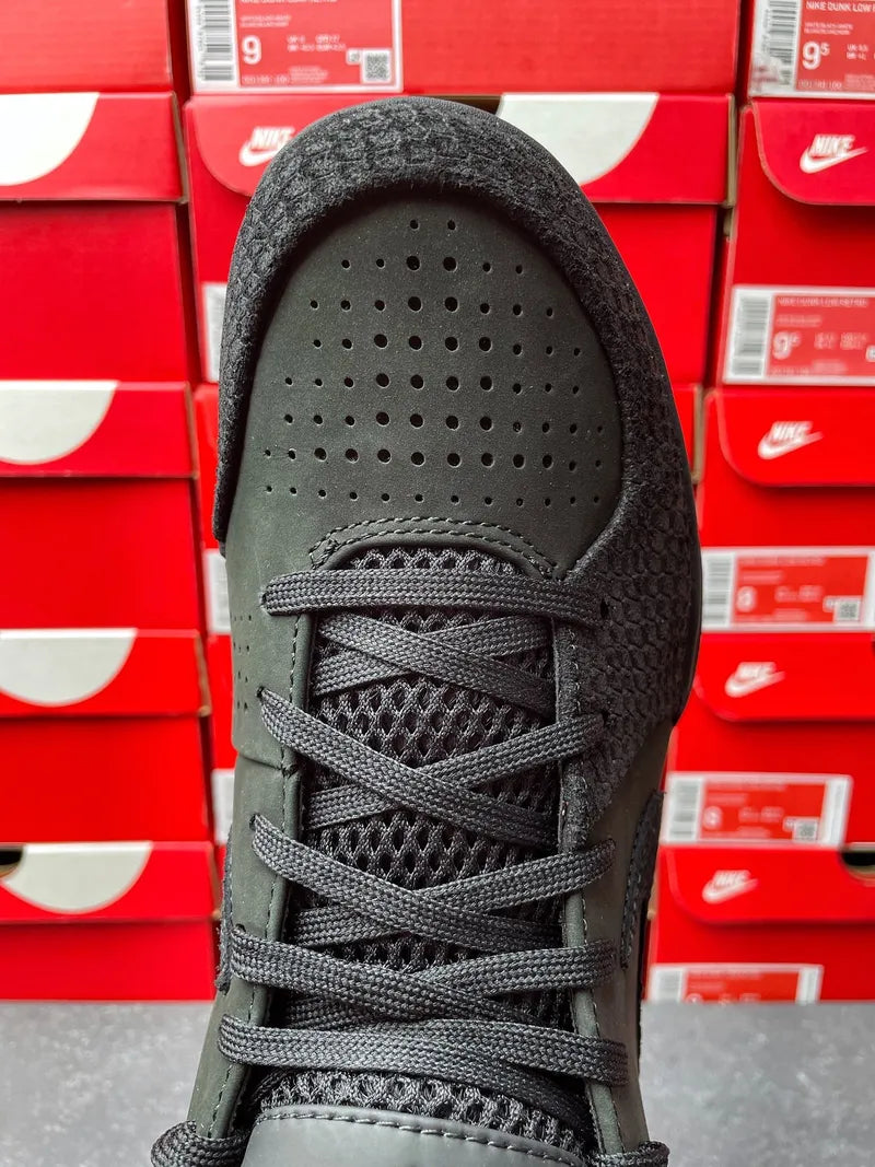 Black suede-style sneaker toe and lacing with perforations on forefoot