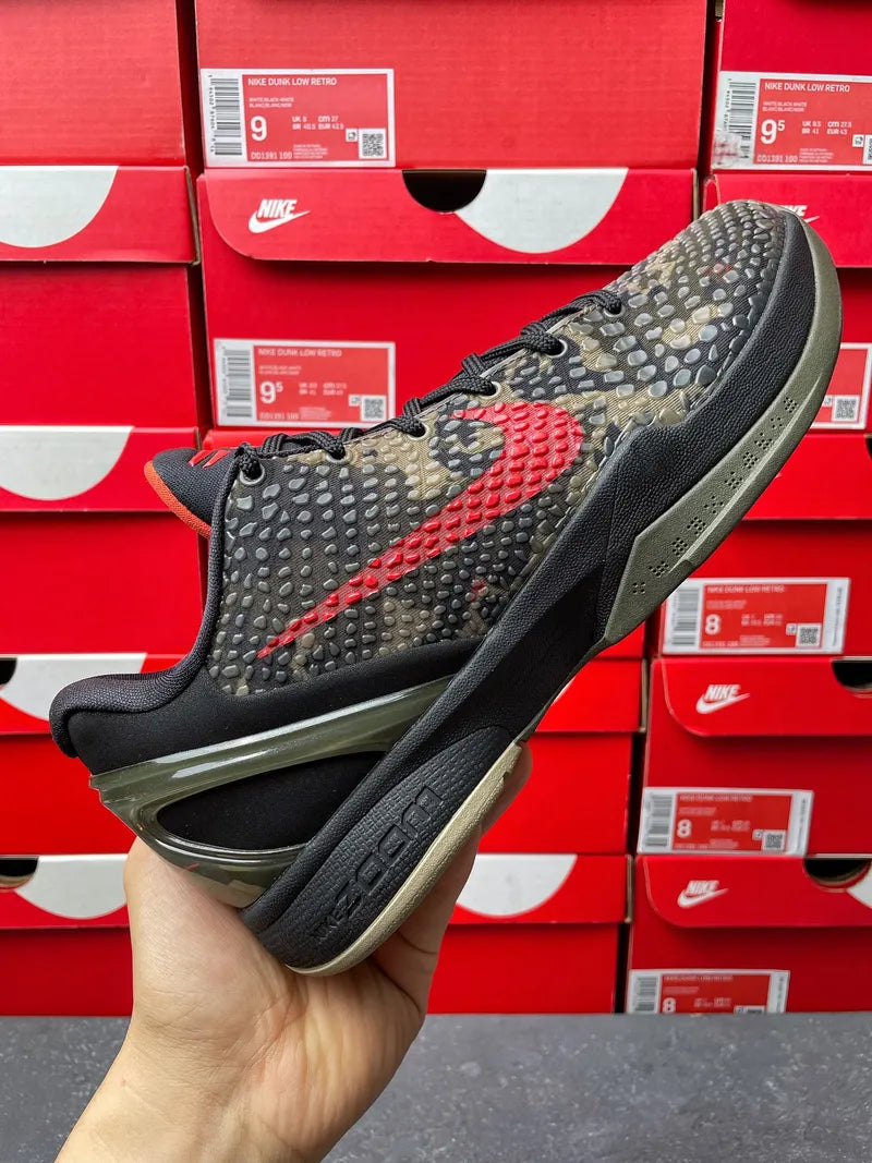 Mens basketball shoe with black and camo-pattern upper, red swoosh detail, low-cut style