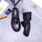 Black Versace leather loafers and side profile view, gold emblem detail, rugged tread