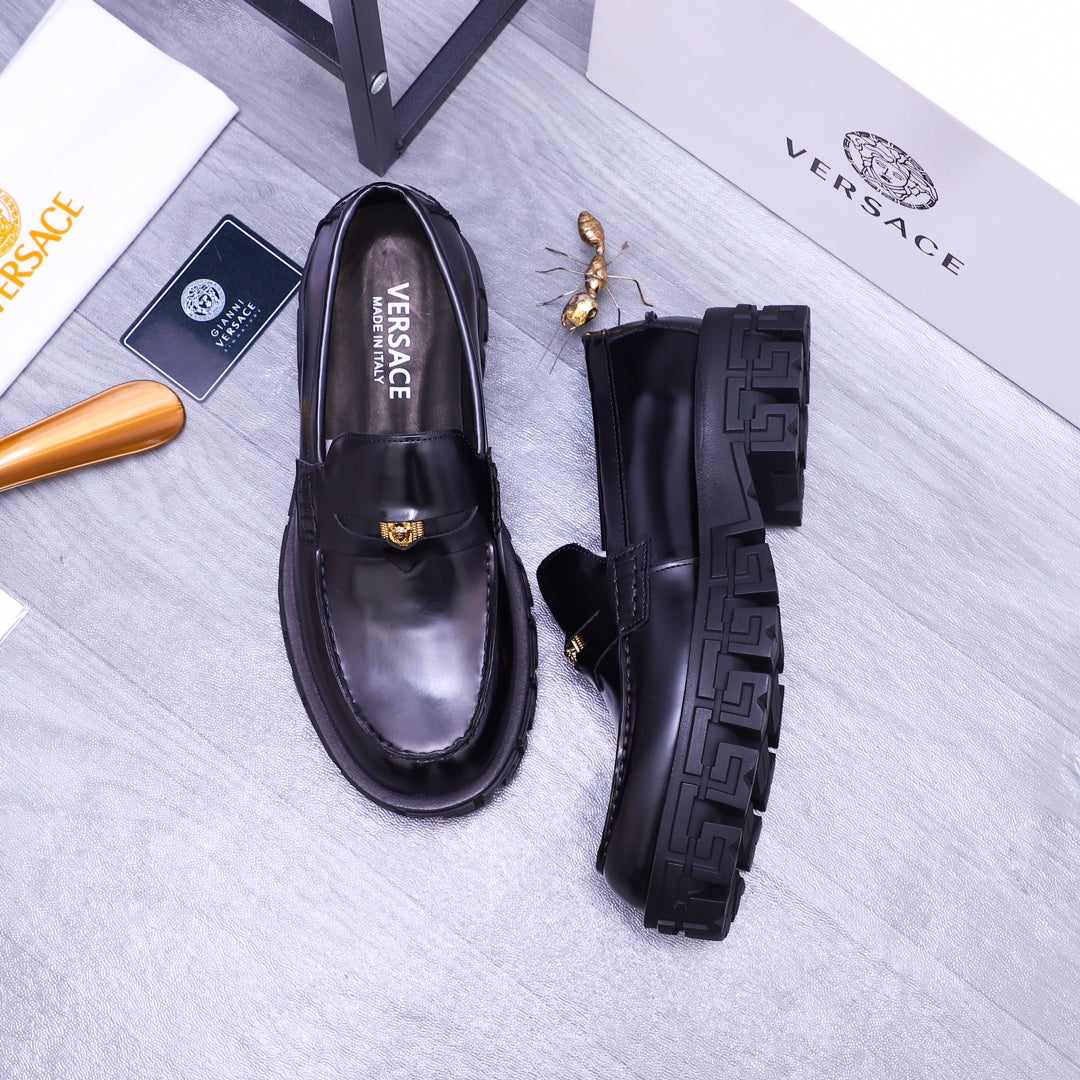 Black Versace leather loafers and side profile view, gold emblem detail, rugged tread