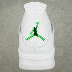 White sneaker heel close-up with green Jumpman logo patch