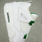 White sneaker side view with green lace strap details and textured mesh panel