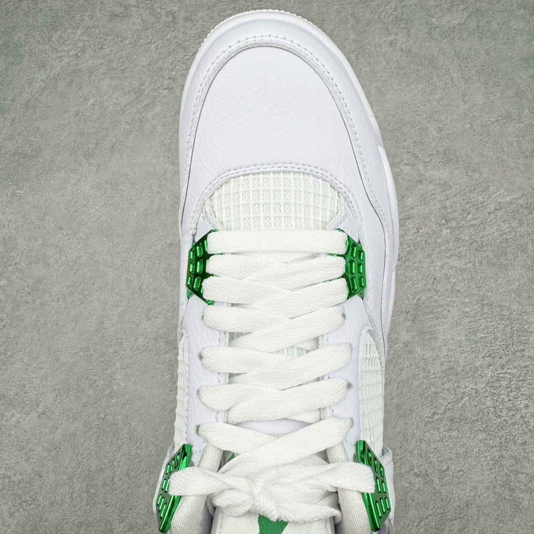 White sneaker upper close-up with green lace cover and mesh tongue