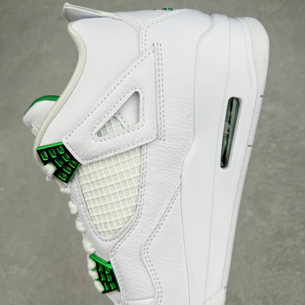White sneaker quarter view with green lace strap and side Air window
