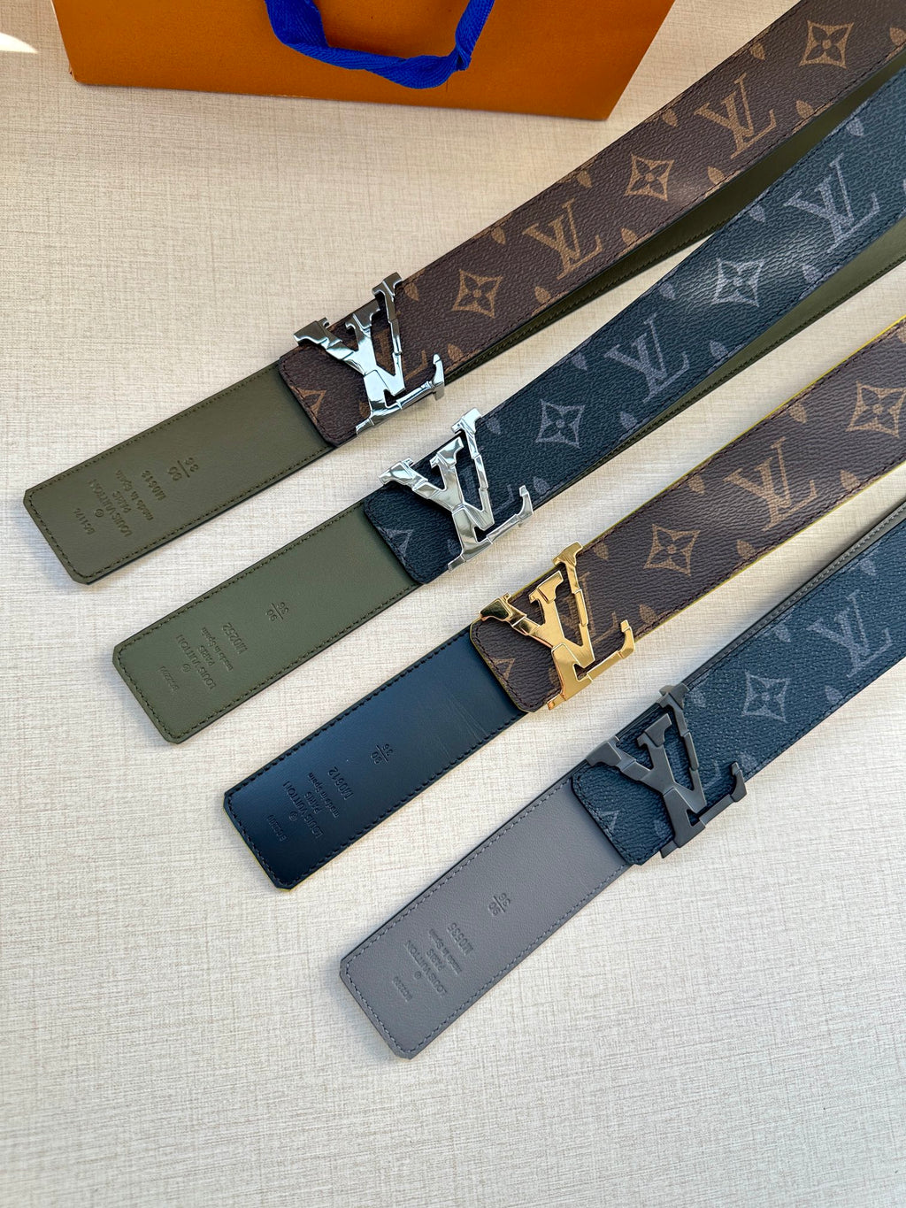 Louis Vuitton belt set with monogram canvas straps, silver-tone buckles, and leather ends