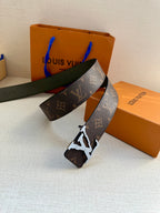 Louis Vuitton monogram canvas belt with dark green leather backing and silver-tone buckle