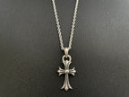 Silver-tone cross pendant necklace with four-point arms and heart-shaped top bail